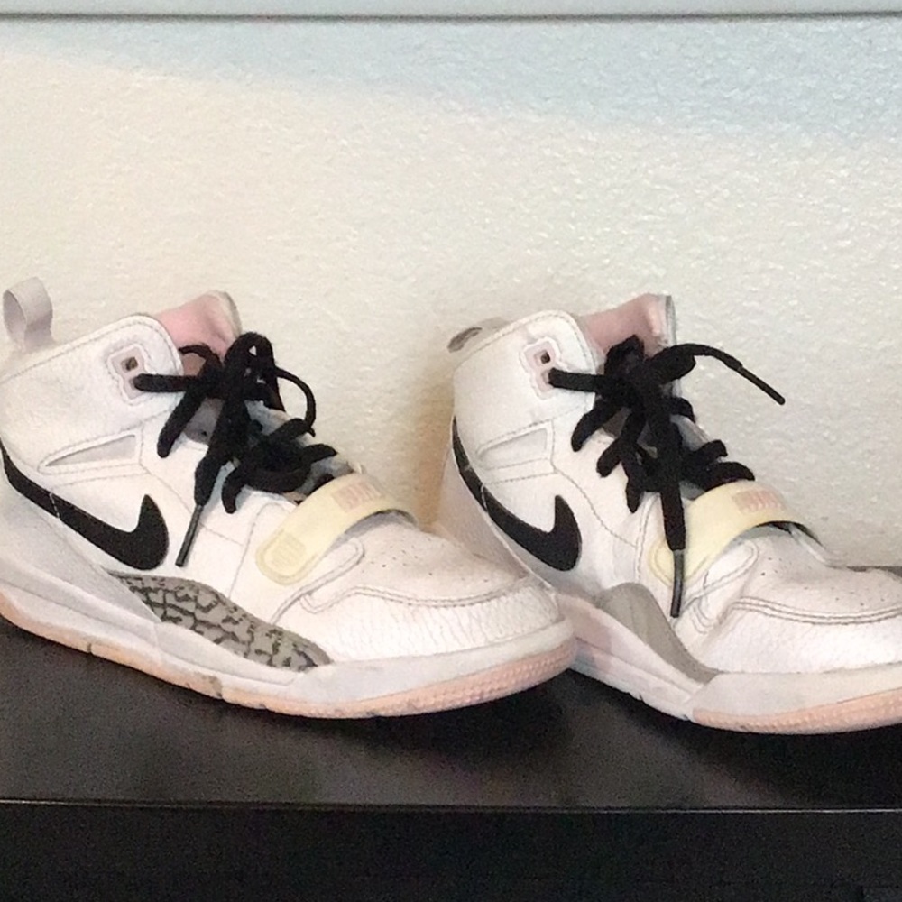 Nike Air Jordan, white with pink, black, and grey accents. Size 2y (21cm).